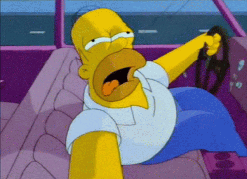 Homer Simpson Is Sitting In The Driver 'S Seat Of A Car With His Mouth Open GIF