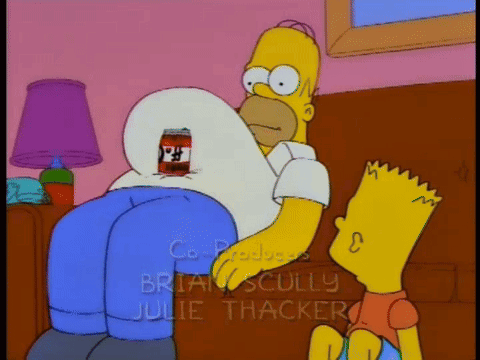 Homer Simpson Is Sitting On A Couch With Bart Standing Next To Him GIF