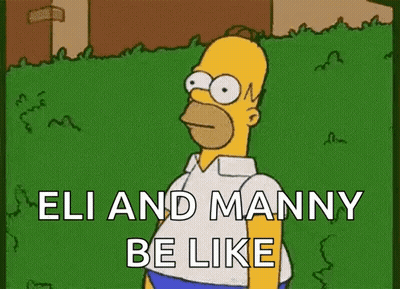Homer Simpson Is Standing In The Grass With The Words `` Eli And Manny Be Like '' Written On It . GIF