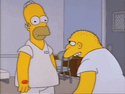 Homer Simpson Is Standing Next To A Bald Man In A White Shirt GIF