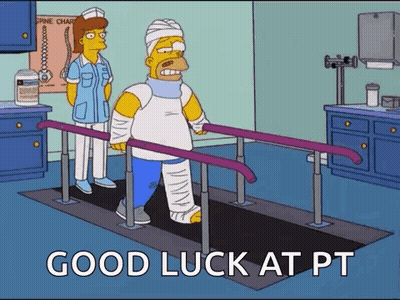 Homer Simpson Is Walking On Parallel Bars In A Hospital While A Nurse Stands Behind Him . GIF