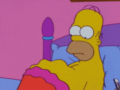Homer Simpson Laying In A Bed With A Pink Blanket GIF