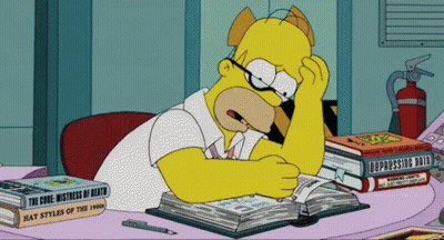Homer Simpson Sits At A Desk With A Stack Of Books One Of Which Is Titled Depressing Death GIF