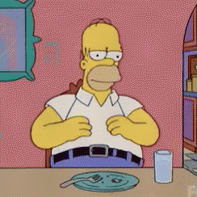 Homer Simpson Sitting At Table GIF
