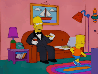 Homer Simpson Sitting On A Couch Eating A Pizza GIF