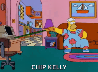 Homer Simpson Sitting On Couch Holding Broom Chip Kelly GIF