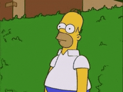 Homer Simpson Standing In Front Of Green Fence GIF