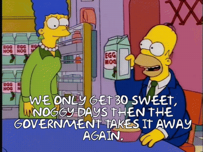 Homer Simpson Talking To Marge Simpson With Egg Nog GIF