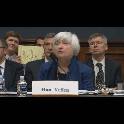Yellen Sitting At Table With Buy Days Sign GIF