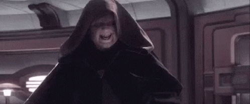 Hooded Man Standing In Room GIF