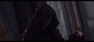 Hooded Person Standing In Darkness GIF