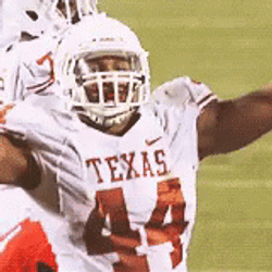 Hook Em Player Waving Hand With Their Sign GIF