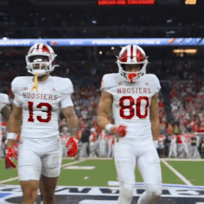Hoosier Football Players 13 And 80 Walking On Field GIF