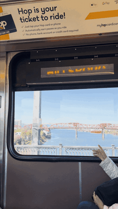 Hop Is Your Ticket To Ride Sign Above Window GIF