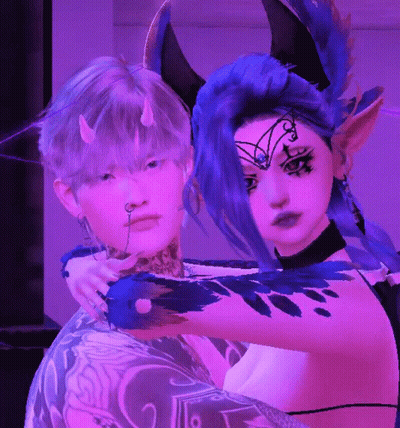 Horned Woman Hugging Tattooed Man GIF