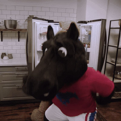 Horse Mascot Standing In Front Of Refrigerator GIF