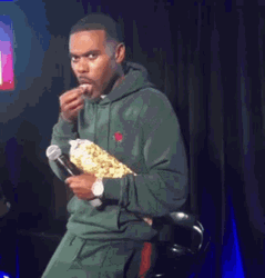Host Enjoying Eating Popcorn