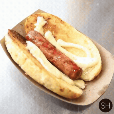 Hot Dog In Cardboard Container Saying Sh GIF