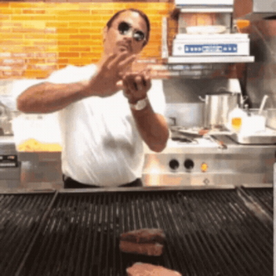 Hot Dog Mascot Pushing Gold Cart GIF