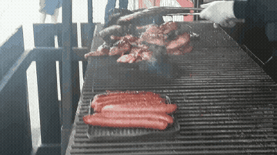 Hot Dogs Cooking On Grill GIF