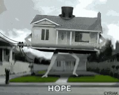 House With Top Hat On Street GIF