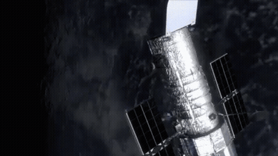 Hubble Space Telescope Flying Through Space GIF