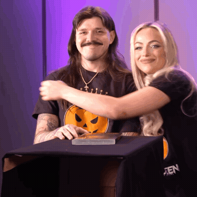 Hugging Couple Woman In Black Pumpkin Shirt GIF