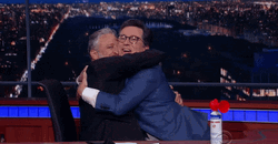 Hugging Happy Stephen Colbert GIF