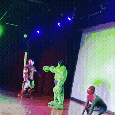 Hulk And Spider-Man Are On A Stage In Front Of A Screen GIF