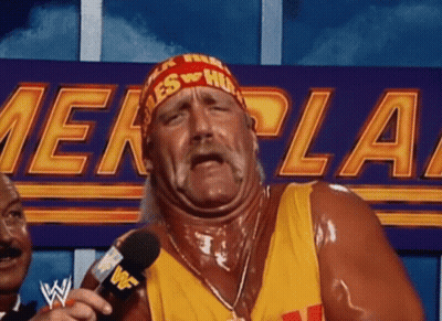 Hulk Hogan Is Talking Into A Microphone In Front Of A Sign That Says ' Wwe ' On It . GIF
