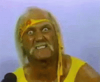 Hulk Hogan Is Wearing A Yellow Shirt And A Yellow Headband While Speaking Into A Microphone . GIF