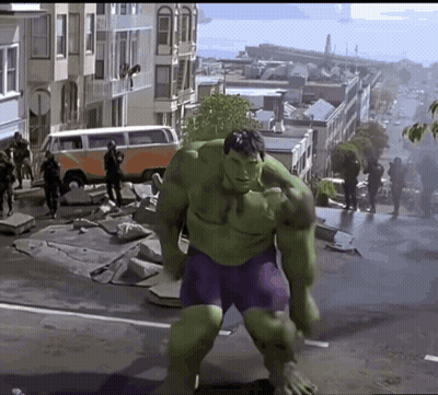 Hulk in Purple Shorts Walking Down Street