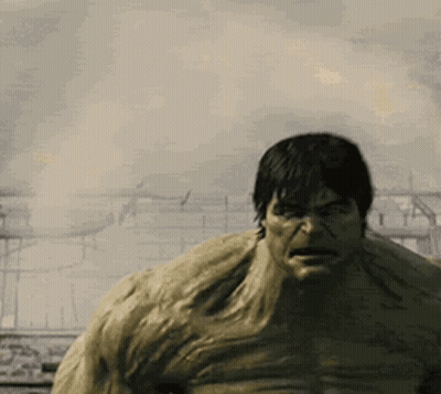 Hulk Standing In Front Of Burning Building GIF