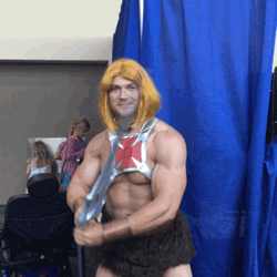 Hunk Cosplay He-Man Flexing Sword GIF
