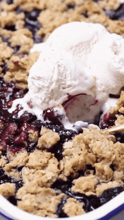 Ice Cream Scooped From Blueberry Crisp GIF