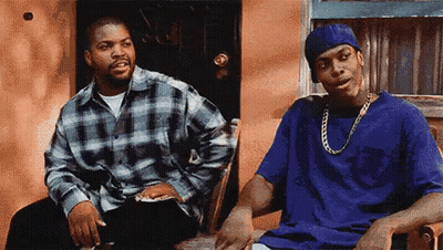 Ice Cube And Snoop Dogg Are Sitting In A Chair Talking To Each Other . GIF