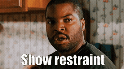 Ice Cube Saying Show Restraint In Front Of Floral Wallpaper GIF
