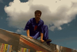 Idiocracy Guy Jumping And Swinging Wrecking Ball GIF