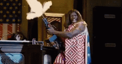 Idiocracy Terry Crews Holding Gun While Shooting GIF