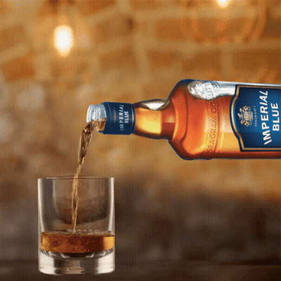 Imperial Blue Seagram Whisky Poured Into Glass GIF