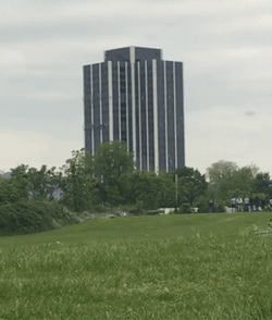 Implosion Of Building Distant View GIF