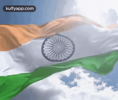 Indian Flag Waving In Wind Against Blue Sky With Clouds GIF