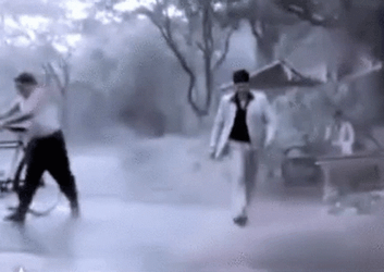Indian Guy Playing In Monsoon Water GIF