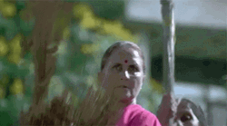 Indian Mothers Holding A Broom GIF