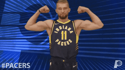 Indiana Pacers Player Flexing Muscles On Blue Background GIF