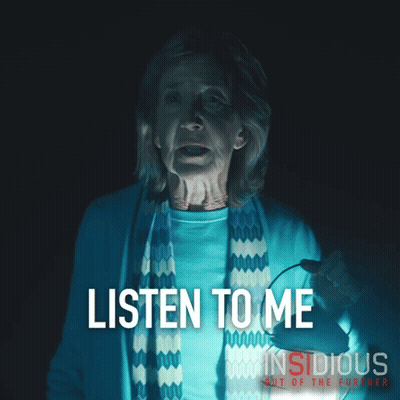 Insidious Out Of The Further Poster Woman Holding Lantern GIF