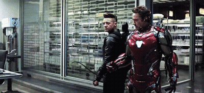 Iron Man And Hawkeye Standing In A Room GIF