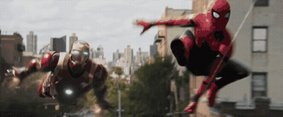 Iron Man And Spider-Man Are Flying Through The Air In A City GIF