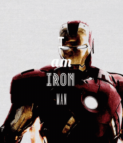 Iron Man Standing In Front Of City At Night GIF