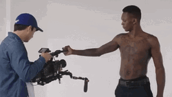 Israel Adesanya Flexing His Bicep GIF